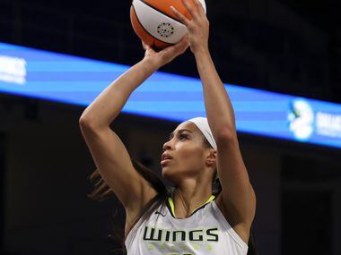 Dallas Wings forward Isabelle harrison shoots during the second half of their game against...