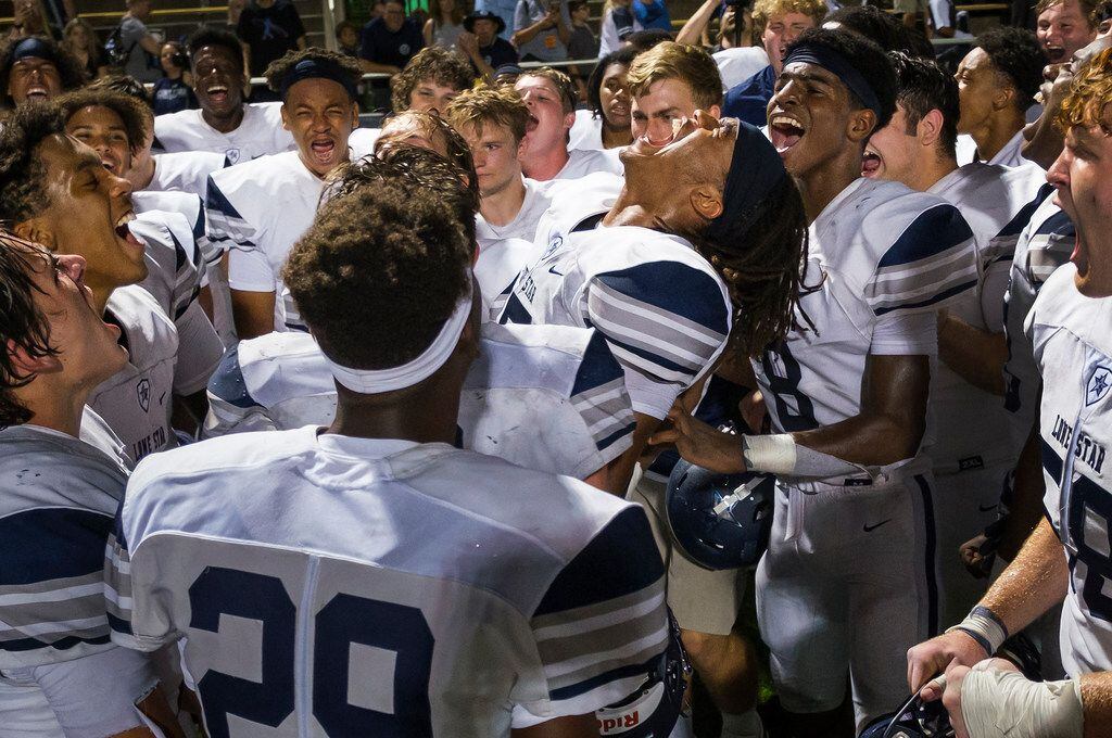 Frisco Lone Star safety Toren Pittman (15) lets out a yell as he celebrates with teammates...