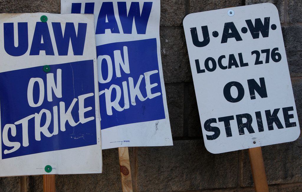 Picket signs at Gate 7 at theGeneral Motors Assembly Plant early Monday morning, September...