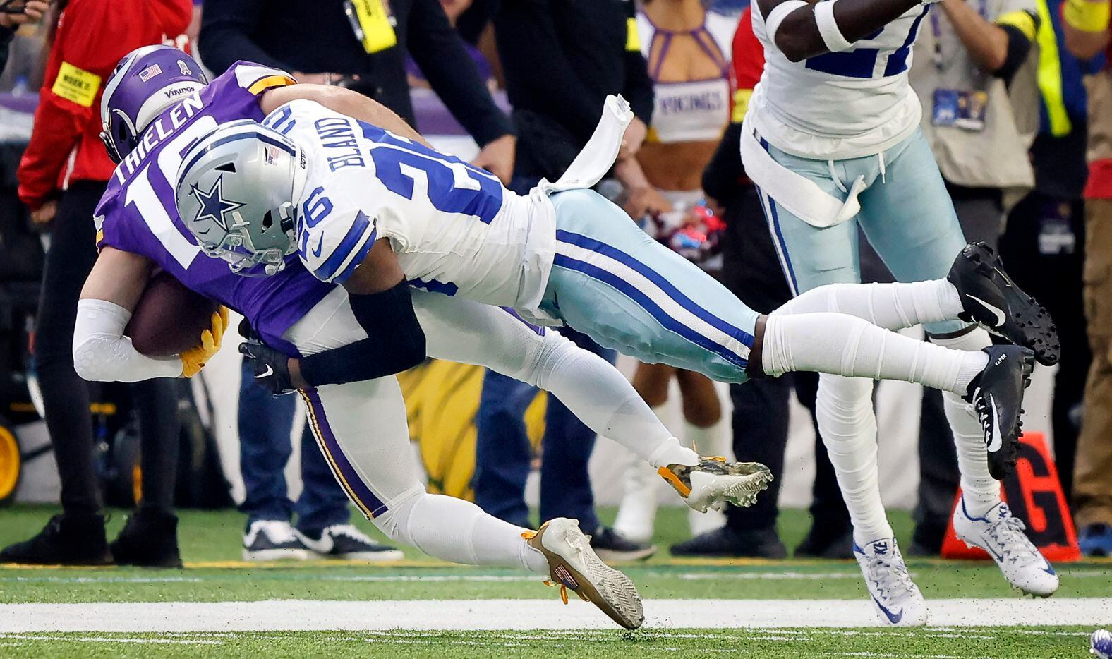 Dallas Cowboys cornerback DaRon Bland (26) makes a diving tackle of Minnesota Vikings wide...