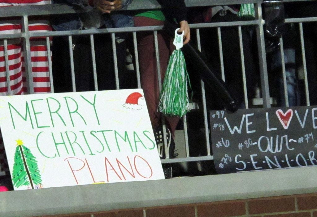 Signs in the Prosper student section in the first half of a high school football game...