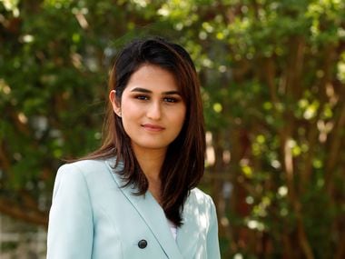 Maha Razi, a senior at SMU, posed for a portrait outside her home in Plano on April 28. Razi is on track to graduate in December.
