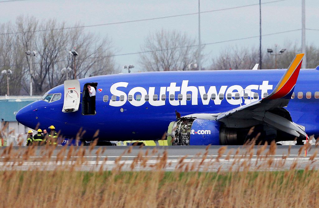 A Southwest Airlines plane sits on the runway at Philadelphia International Airport after it...