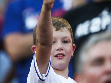 A young fan tip his hat off to AdriÃ¡n BeltrÃ© as he is introduced amongst the Globe Life...