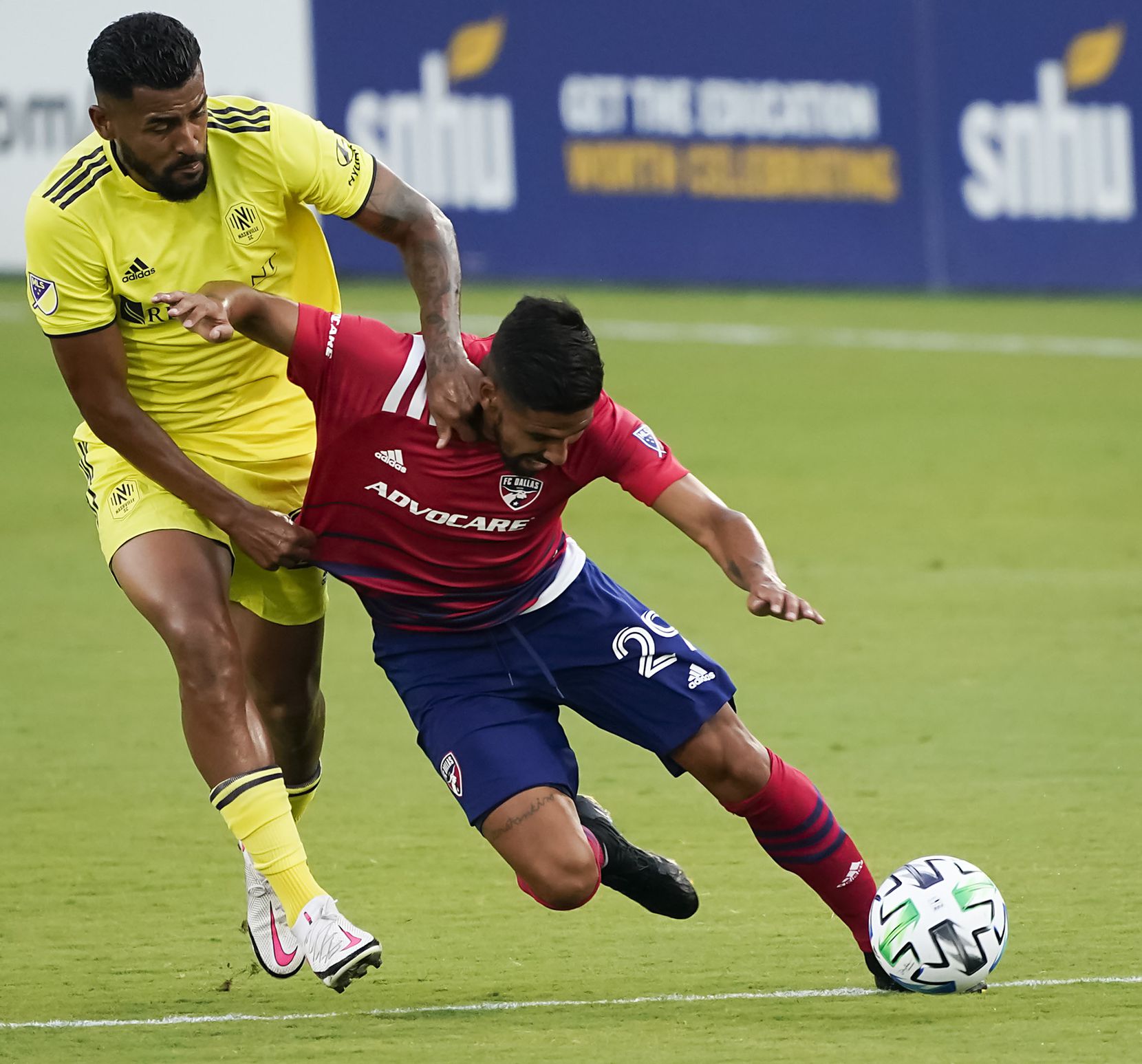 FC Dallas forward Franco Jara (29) is pulled down by Nashville SC midfielder Anibal Godoy (20) during the first half of an MLS soccer game at Toyota Stadium on Wednesday, Aug. 12, 2020, in Frisco, Texas. (Smiley N. Pool/The Dallas Morning News)