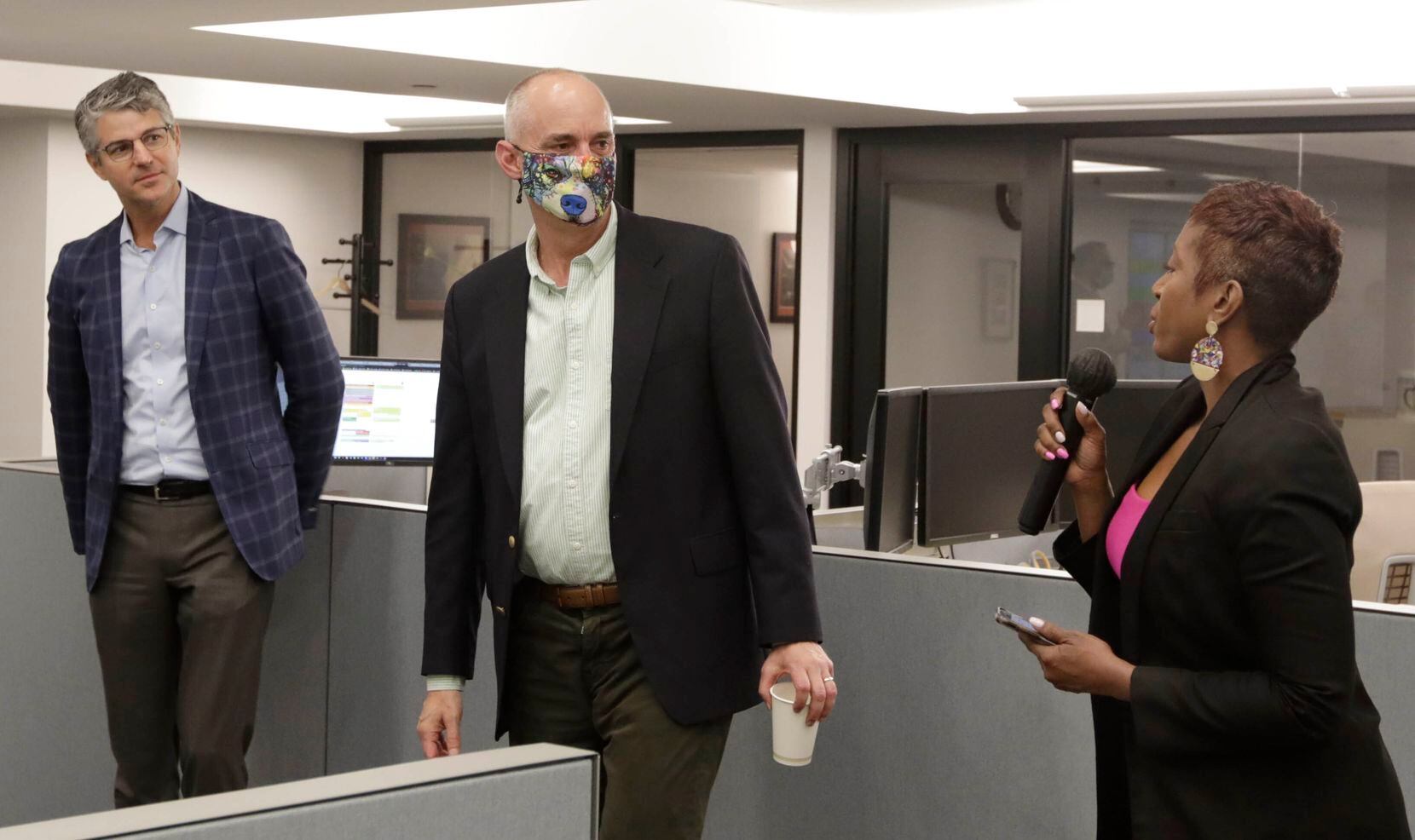 Katrice Hardy, the newly named executive editor of The Dallas Morning News, thanks managing editor Keith Campbell as she addresses the newsroom and publisher Grant Moise listens on July 21, 2021.