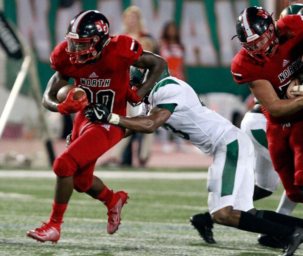North Garland RB Sabron Woods (20) picks up a first down during the first half of the Garland Naaman Forest Vs. North Garland high school football game at Williams Stadium in Garland on Friday, October 4, 2019. (John F. Rhodes / Special Contributor)