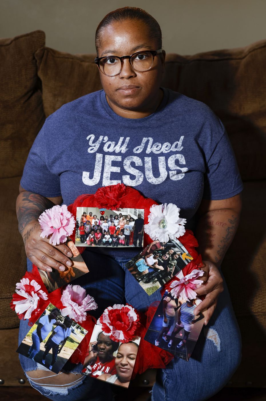 Courtney Williams with a wreath of photos of her niece, Brionne.