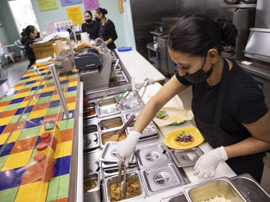 Leticia Galindo prepares a taco at Milagro Tacos Cantina on Wednesday, Jan. 19, 2022, in...