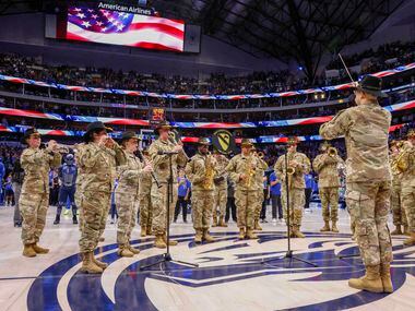 The U.S. Army First Cavalry Division Band perform the National Anthem before an NBA game...