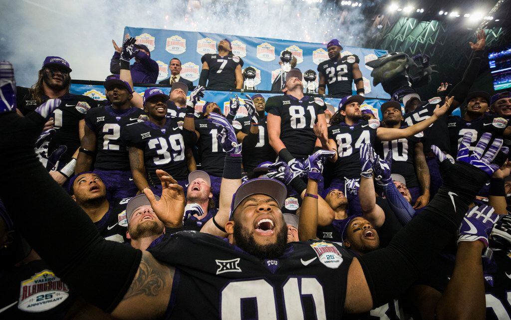 TCU Horned Frogs celebrate a 39-37 win over the Stanford Cardinals after the Valero Alamo...