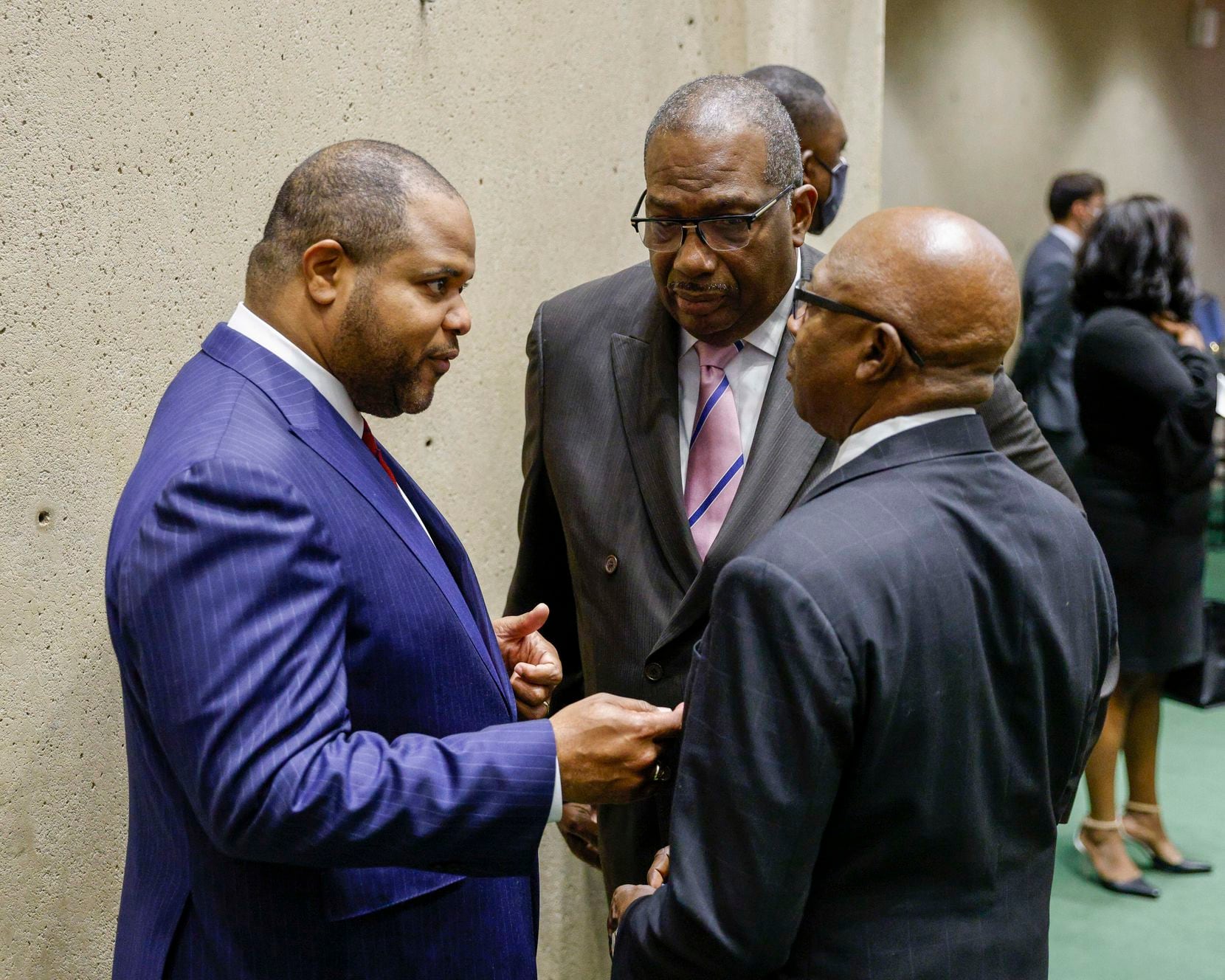 Dallas Mayor Eric Johnson (left) speaks with state Sen. Royce West (center) and council member Tennell Atkins after his state of the city address at City Hall in Dallas on Wednesday, Nov. 17, 2021. (Elias Valverde II/The Dallas Morning News)