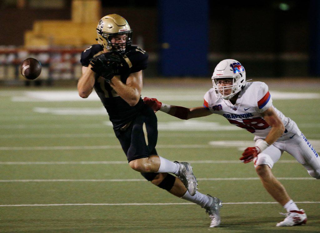 The ball gets away from Birdville's Gage Haskin (12) as he is defended by Grapevine's Dylan...