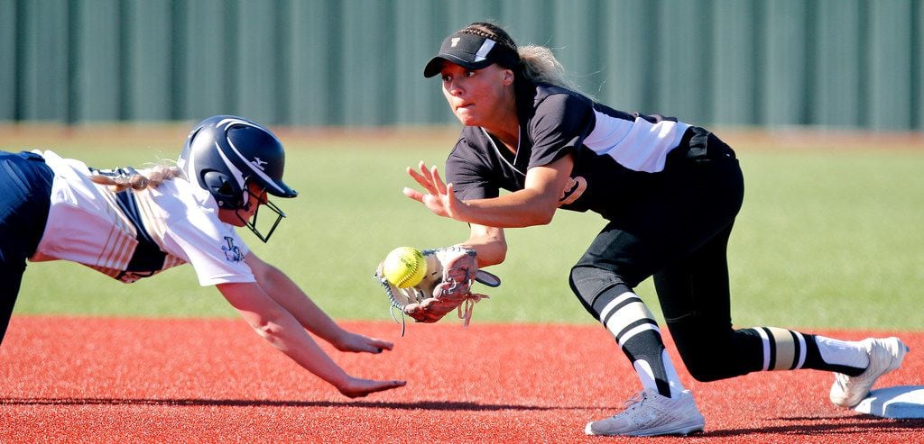 Little Elm center fielder Tatum Mowery (3) was ruled safe at second base as The Colony shortstop Jayda Coleman (10) attempts the tag on a pick off play in the third inning as The Colony High School played Little Elm High School in a playoff game held at Prosper High School on Tuesday, May 21, 2019.  (Stewart F. House/Special Contributor)