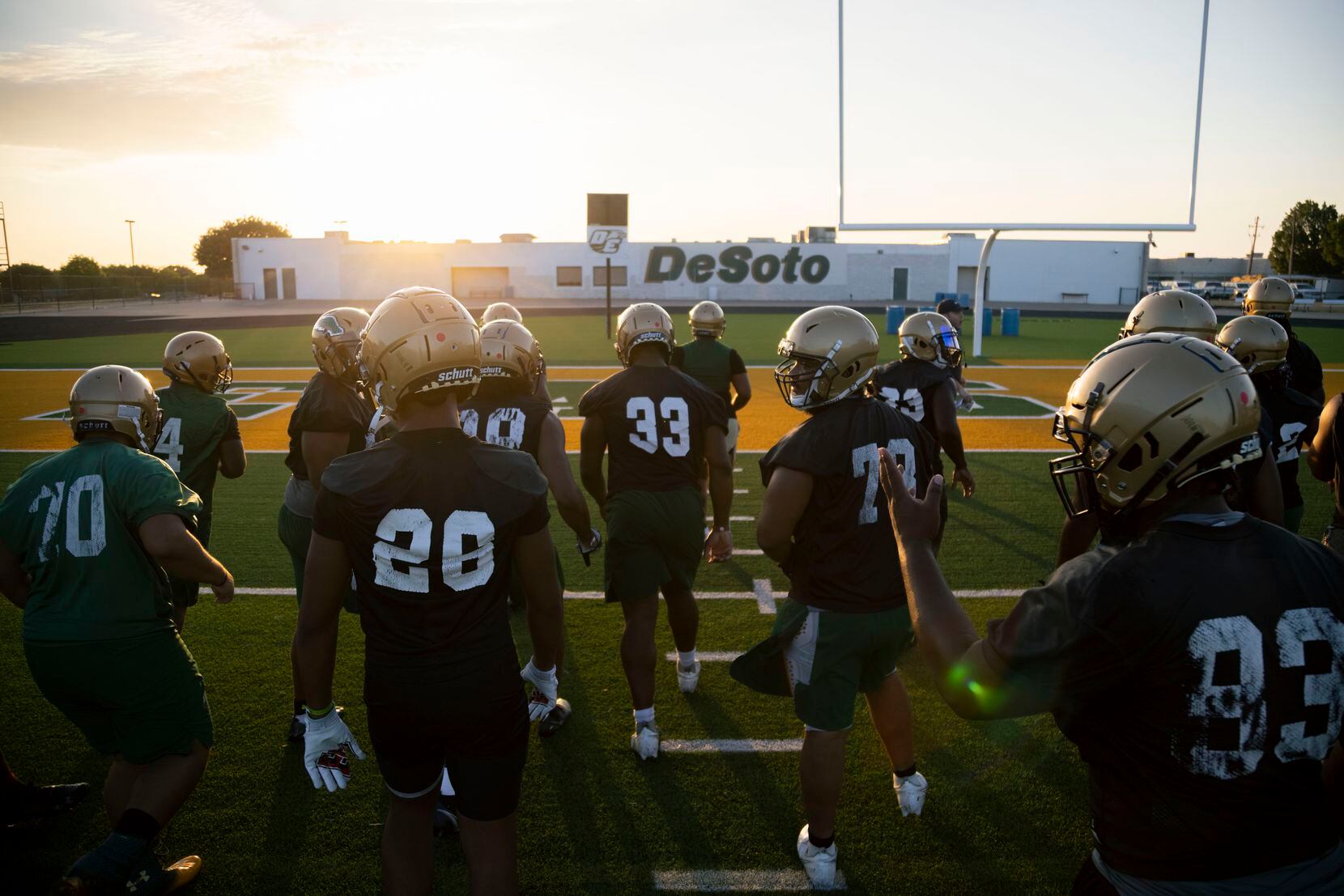 DeSoto football players get ready to run drills during the first practice of the season on...