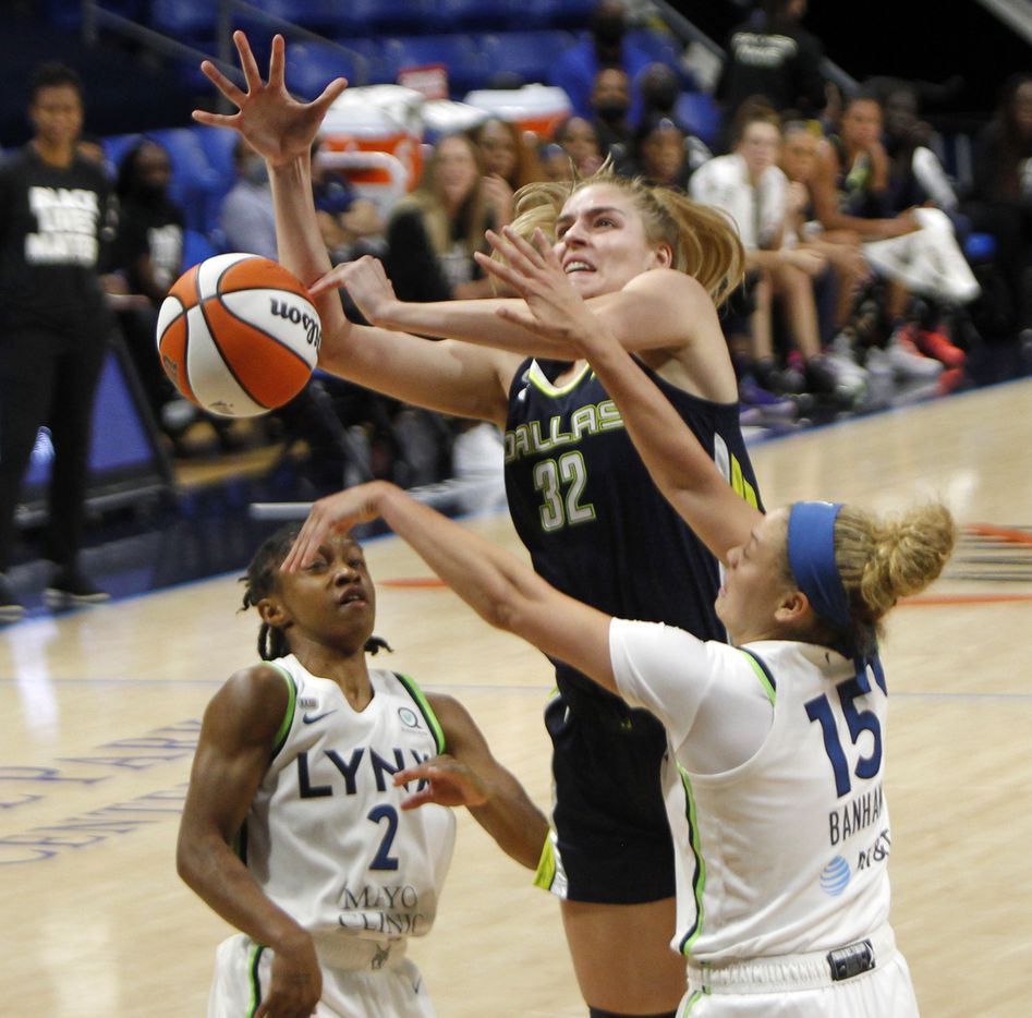 Dallas Wings center Bella Alarie (32) is fouled as she shoots against the defense of Minnesota Lynx guards Rachel Banham (15) and Crystal Dangerfield (2) during 3rd quarter action. The two teams played their WNBA game at College Park Center on the campus of the University of Arlington on June 17, 2021(Steve Hamm/ Special Contributor)