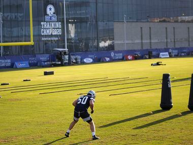 Dallas Cowboys linebacker Sean Lee (50) works out during the first day of training camp at...