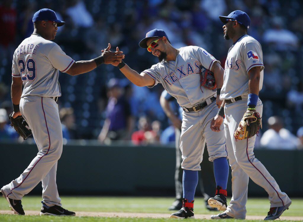 Texas Rangers third baseman Adrian Beltre, left, congratulates second baseman Rougned Odor...