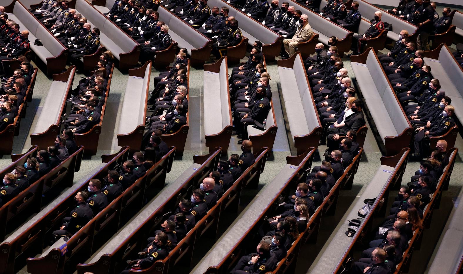 Police officers from departments across the Metroplex are socially distanced in rows as they  attend the funeral service for Dallas Police officer Mitchell Penton at Prestonwood Baptist Church in Plano, Monday, February 22, 2021. Penton was killed Saturday, Feb. 13, 2021, in a crash involving a drunk driving suspect. (Tom Fox/The Dallas Morning News)