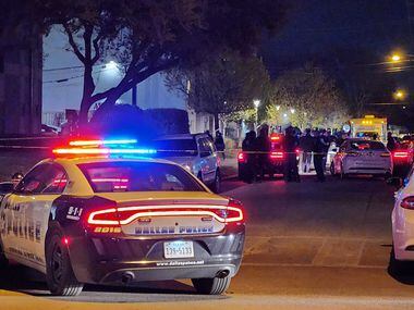 Multiple Dallas police vehicles line the 1900 block of Bennett Avenue in Old East Dallas,...