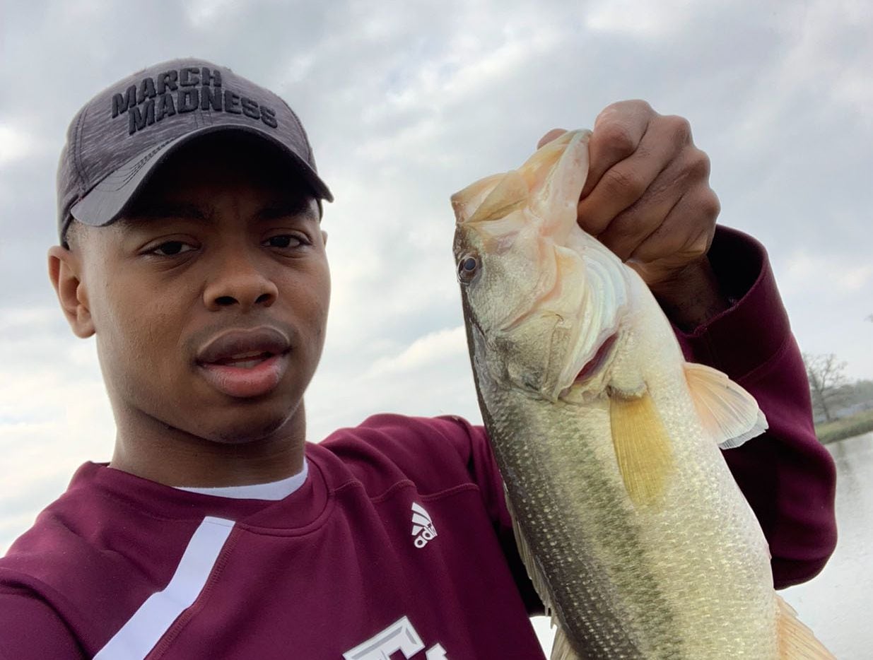 Texas A&M's Wendell Mitchell shows off his catch.