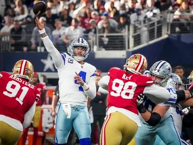 Dallas Cowboys quarterback Dak Prescott (4) throws a touchdown pass to wide receiver Amari Cooper (19) during the first half of an NFL Wild Card playoff football game against the San Francisco 49ers at AT&T Stadium on Sunday, Jan. 16, 2022, in Arlington.