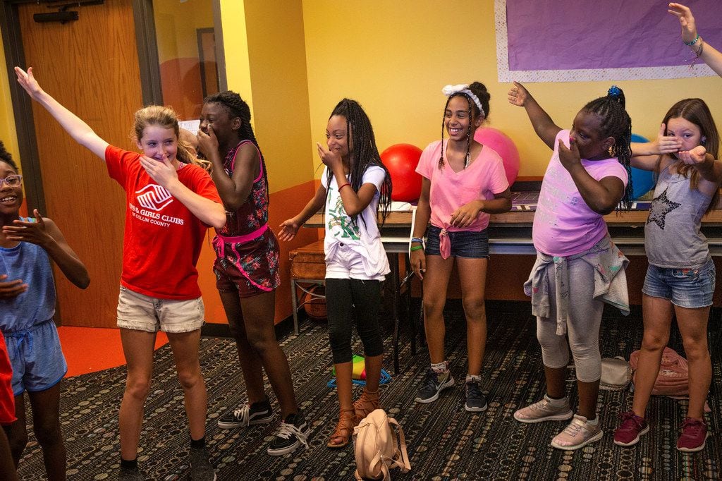 Children participate in a warm-up exercise during a theatre class presented by Humanities of...