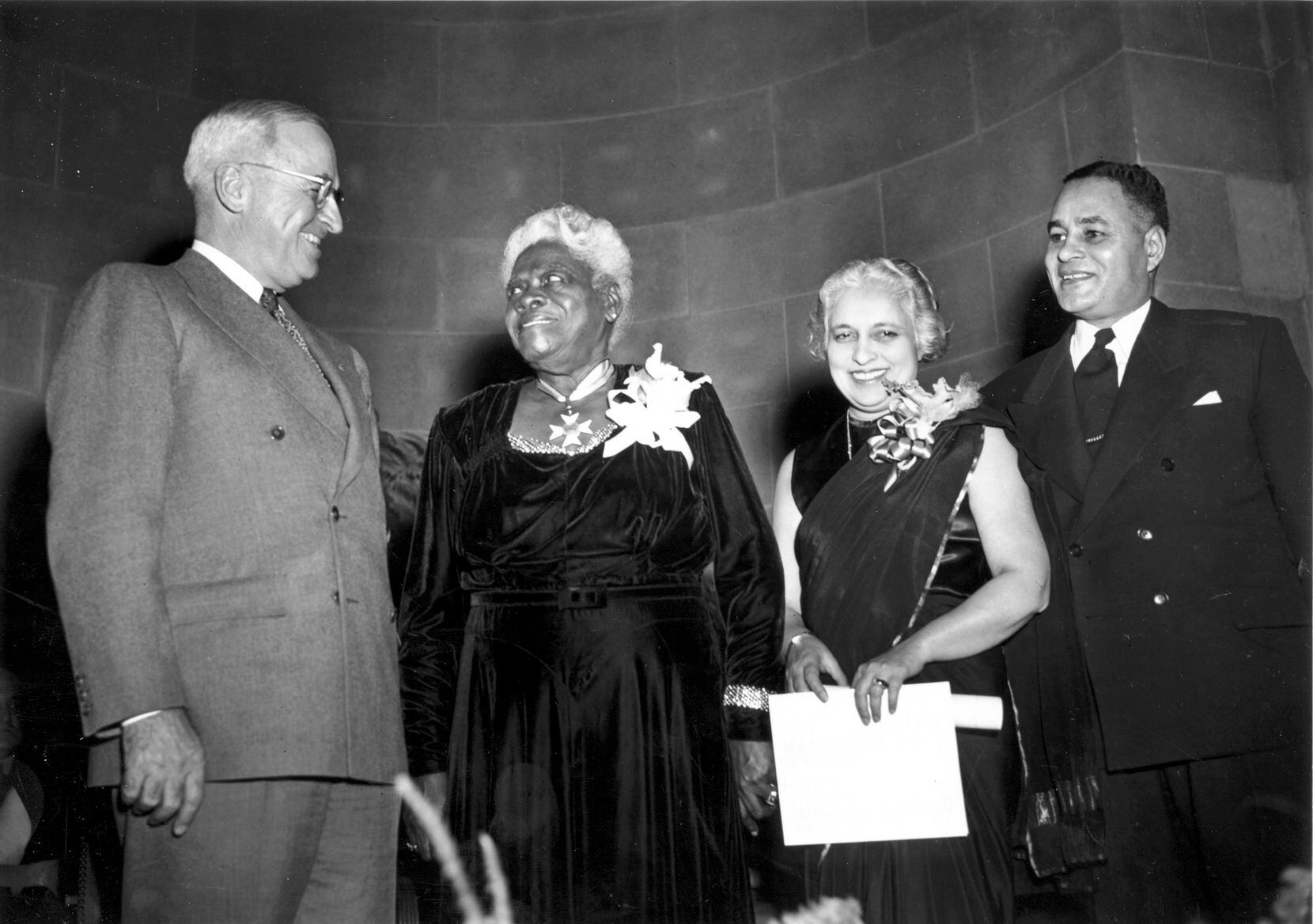 FILE - U.S. President Harry Truman, from left, poses with Mary McLeod Bethune, retiring...