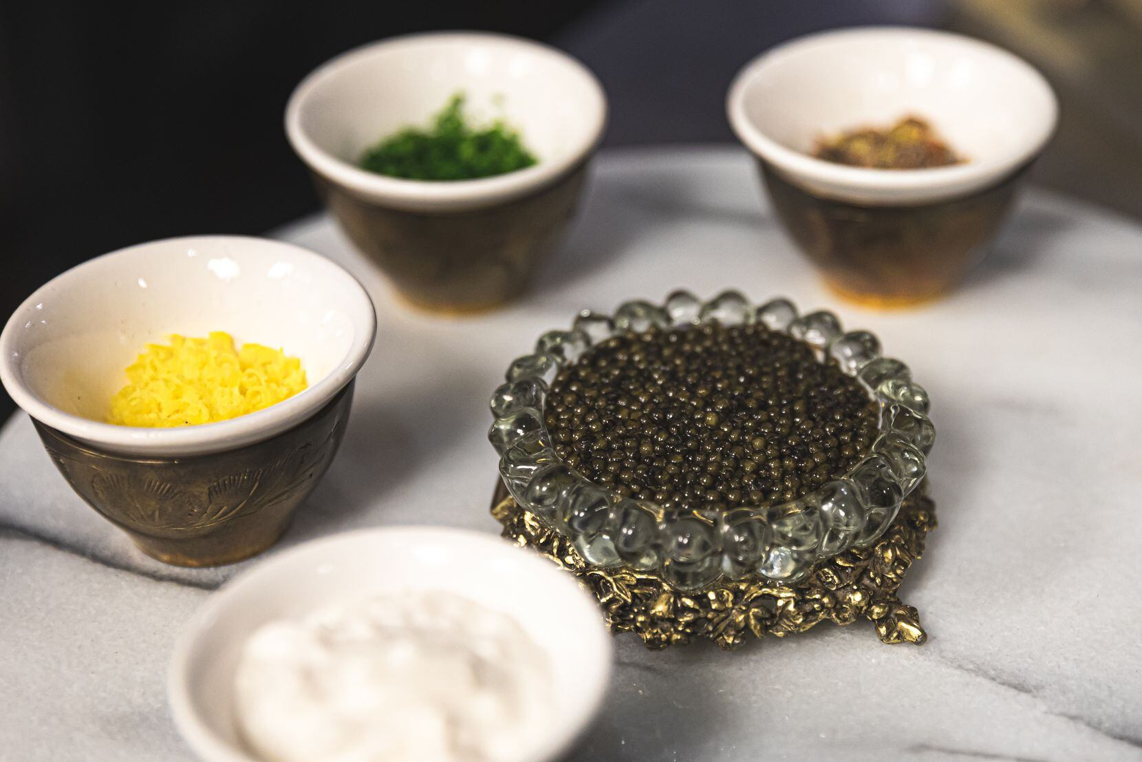 The $500 caviar service at Apothecary in Lower Greenville is no longer called the Kremlin or...
