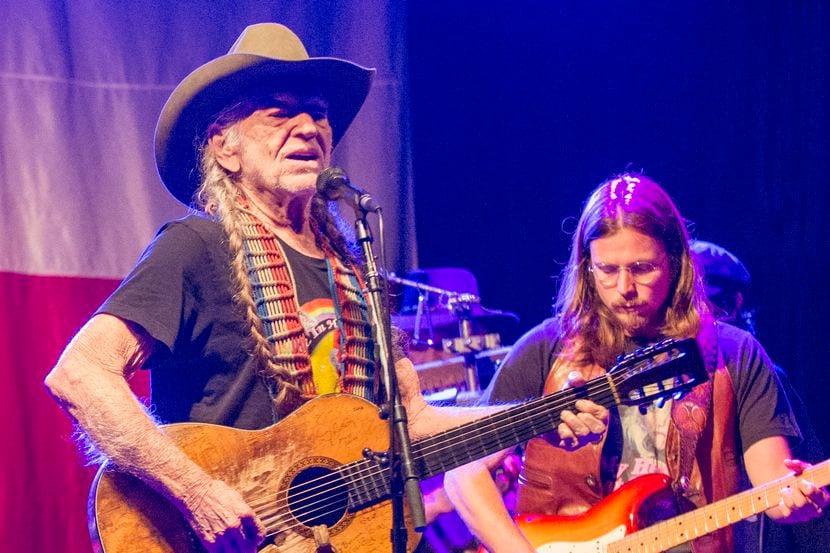 Country music legend Willie Nelson on stage with his son, Lukas Nelson, at right.