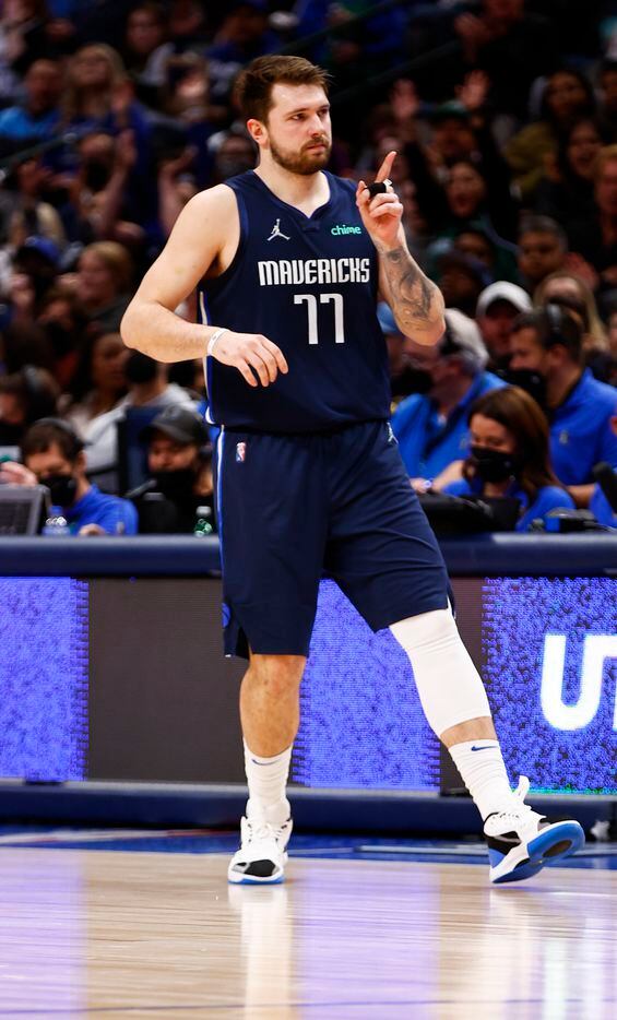 Dallas Mavericks guard Luka Doncic (77) reacts after making a three-point shot during the first half of an NBA basketball game against the LA Clippers in Dallas, Saturday, February 12, 2022. 