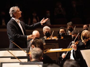 Fabio Luisi conducts the Dallas Symphony Orchestra, the members wearing masks as they perform.