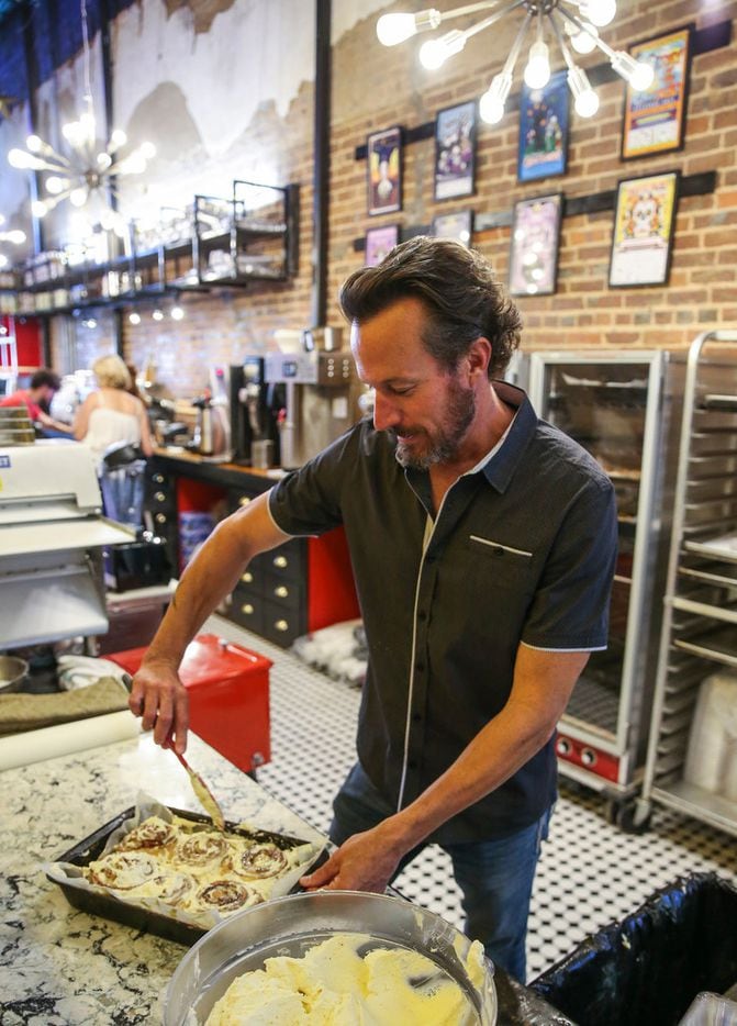 Jupiter House co-owner Joey Hawkins ices cinnamon rolls on Thursday, May 16, 2019 at Jupiter...