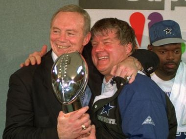 FILE - In this Jan. 30, 1994 file photo, Dallas Cowboys owner Jerry Jones, left, and coach Jimmy Johnson celebrate with the Vince Lombardi trophy after defeating the Buffalo Bills 30-13 in  Super Bowl XXVIII at the Georgia Dome in Atlanta. (AP Photo/Charles Krupa, File)