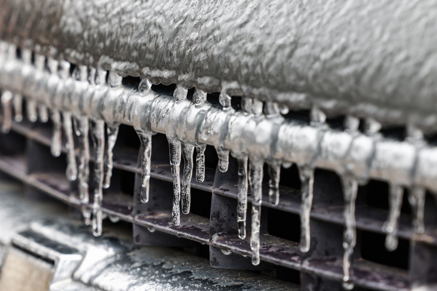 Frozen rainwater on the bumper of a parked car in Dallas on Monday, Jan. 30, 2023.