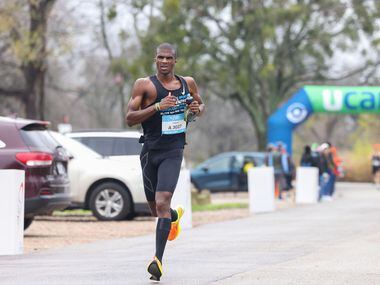 Marathon runner Jordon Garman reaches the 17 mile mark along East Lawther Drive during the...