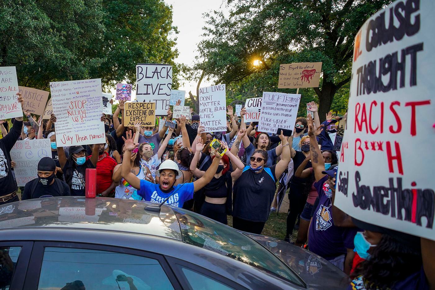 A group of demonstrators gathers at Lake Cliff Park as protests continue after the death of George Floyd on Tuesday, June 2, 2020, in Dallas. Because of the city imposed 7:00 p.m. curfew, the group moved from Dallas City Hall to outside the curfew zone in Oak Cliff.