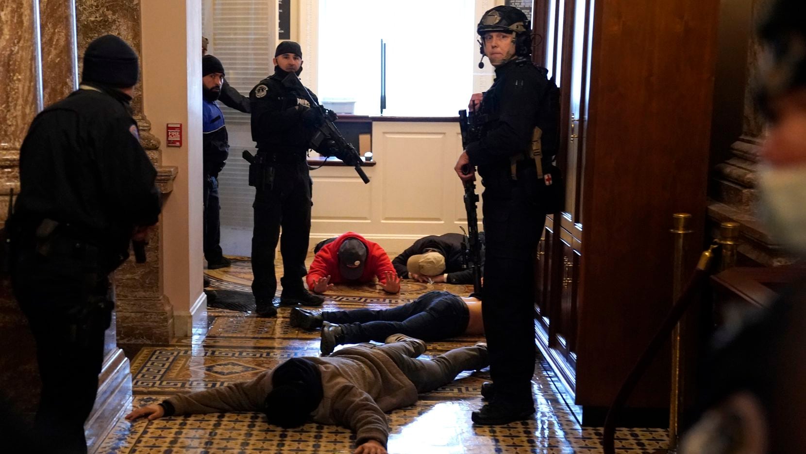 WASHINGTON, DC - JANUARY 06: U.S. Capitol Police stand detain protesters outside of the...
