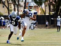 Dallas Cowboys wide receiver Jalen Tolbert (18) pulls in a deep pass as he’s covered by...