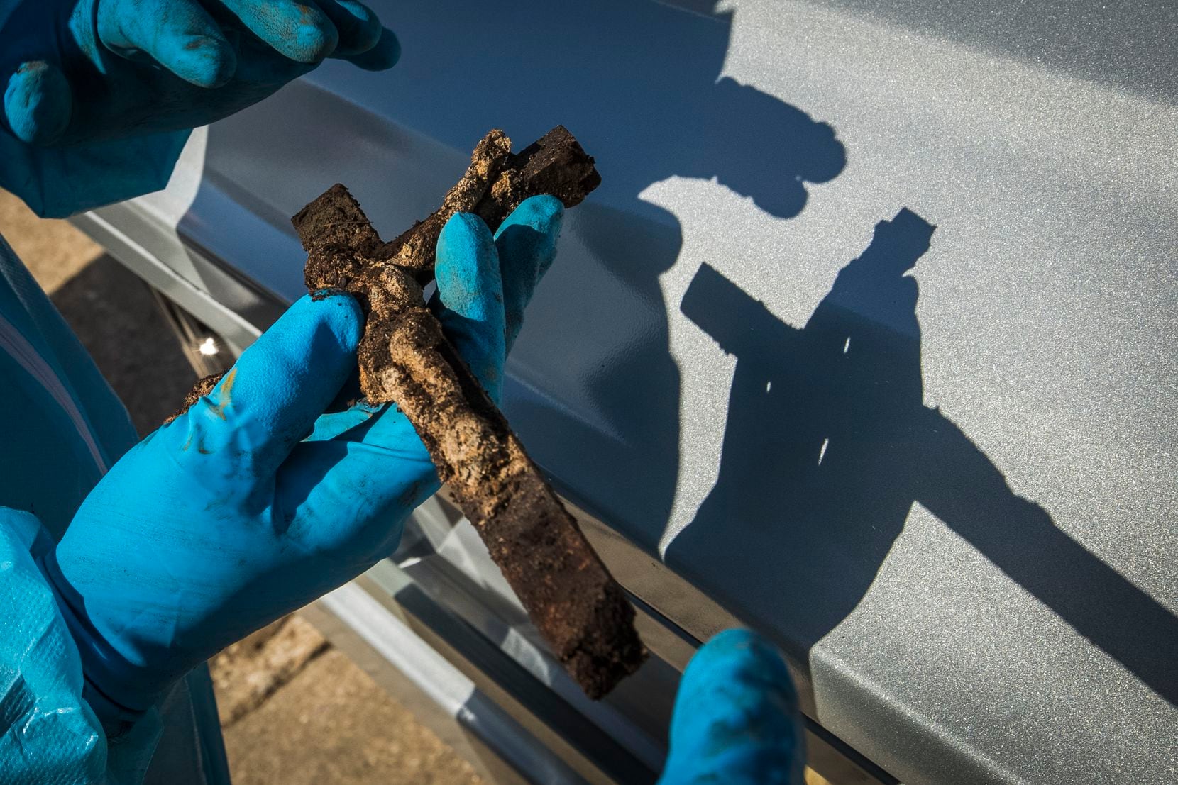 Funeral director Chris Taylor found this crucifix still intact inside the casket of the Rev. Damian Szodenyi, who was buried with it in 1998.  