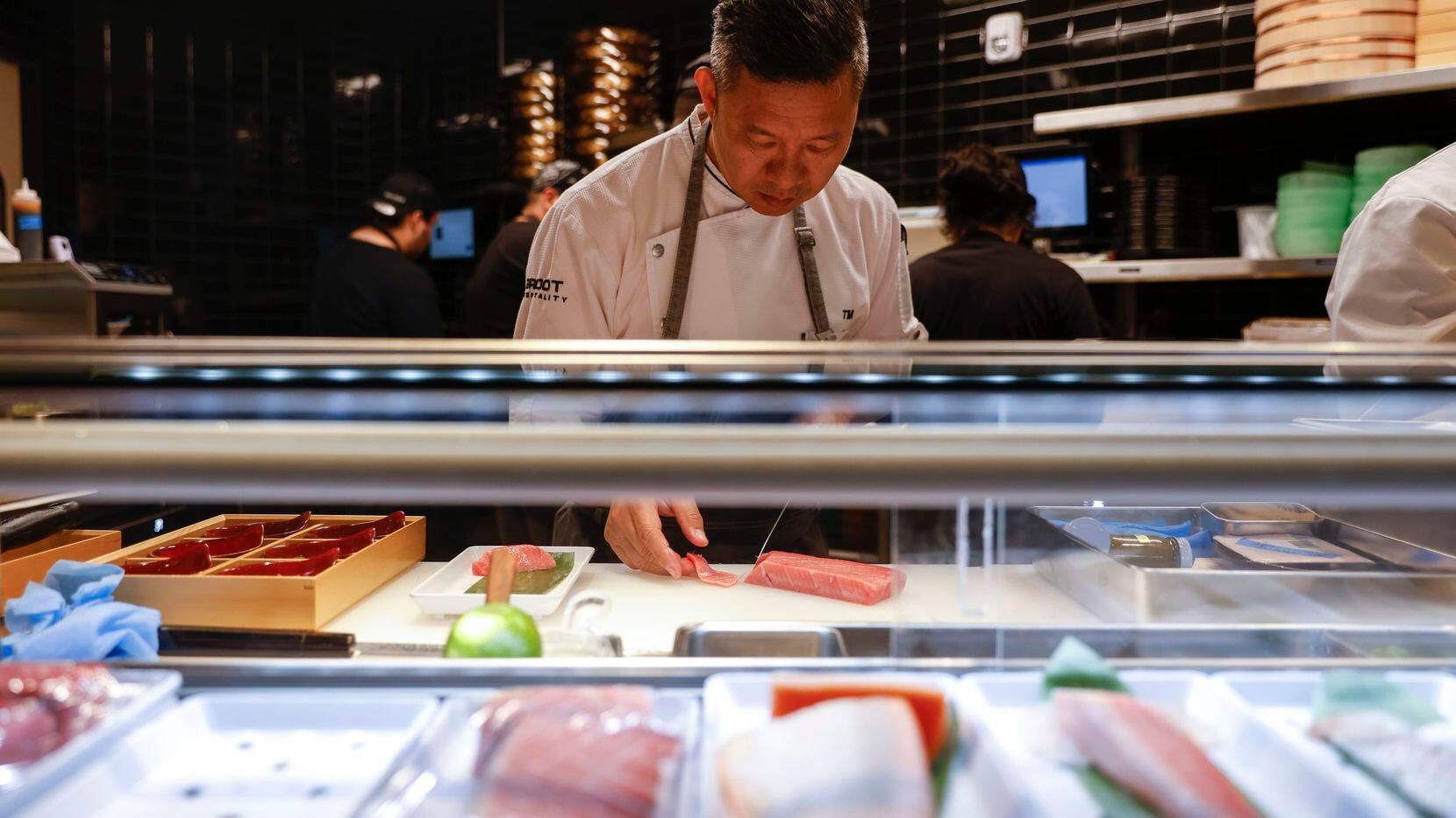 Tony Mai, corporate sushi chef of Komodo Dallas, works in the kitchen on Tuesday, March 28,...