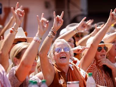 Texas Longhorns fans sing the school song following their loss to the Alabama Crimson Tide...