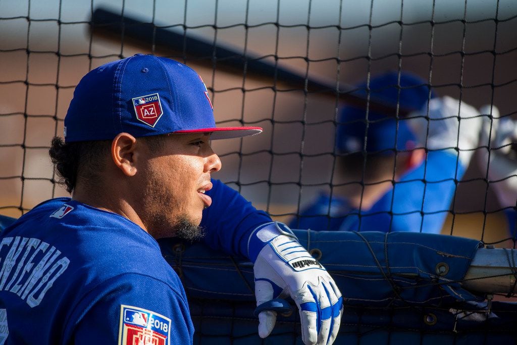 Texas Rangers catcher Juan Centeno waits his turn for batting practice during a spring...