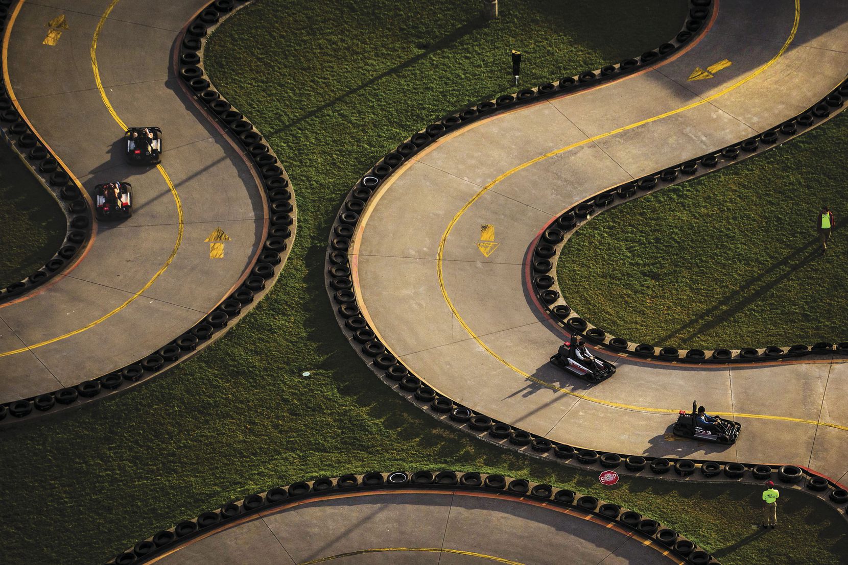 Go-kart drivers zip around the track at Zone Action Park in Lewisville.