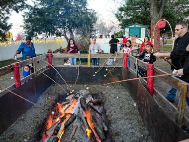 Festival-goers roast marshmallows at a previous year's Christmas in the Park, an annual holiday event held at Mesquite’s Westlake Park, 601 Gross Rd., that turns 35 this year. This year's event takes place Saturday, Dec. 4, and Sunday, Dec. 5, from 2 to 7 p.m.
