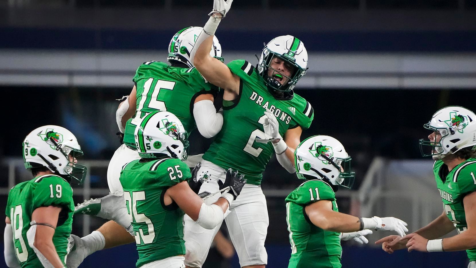 Southlake Carroll linebacker Allan Kleiman (15) celebrates with running back Owen Allen (2) after intercepting a pass during the second half of a high school football game against Highland Park at AT&T Stadium on Thursday, Aug. 26, 2021, in Arlington. (Smiley N. Pool/The Dallas Morning News)