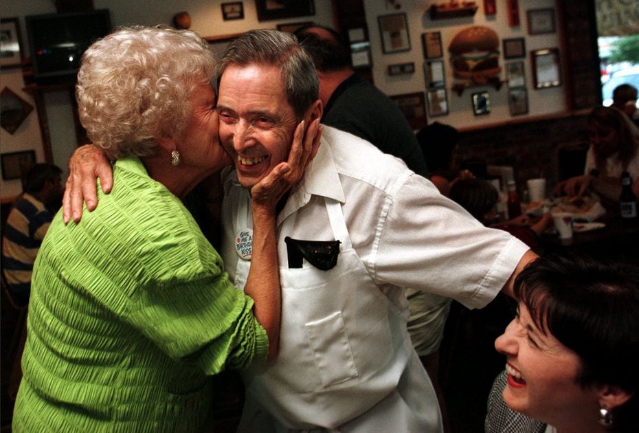 1998 file photo: Fay Lax, left, gives Al's Hamburgers owner Al Mathews a celebratory kiss at...