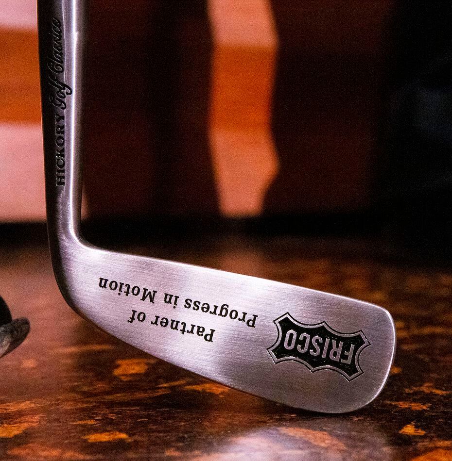 A golf club engraved with "Frisco, Partner of Progress in Motion" was presenented to Darrell...