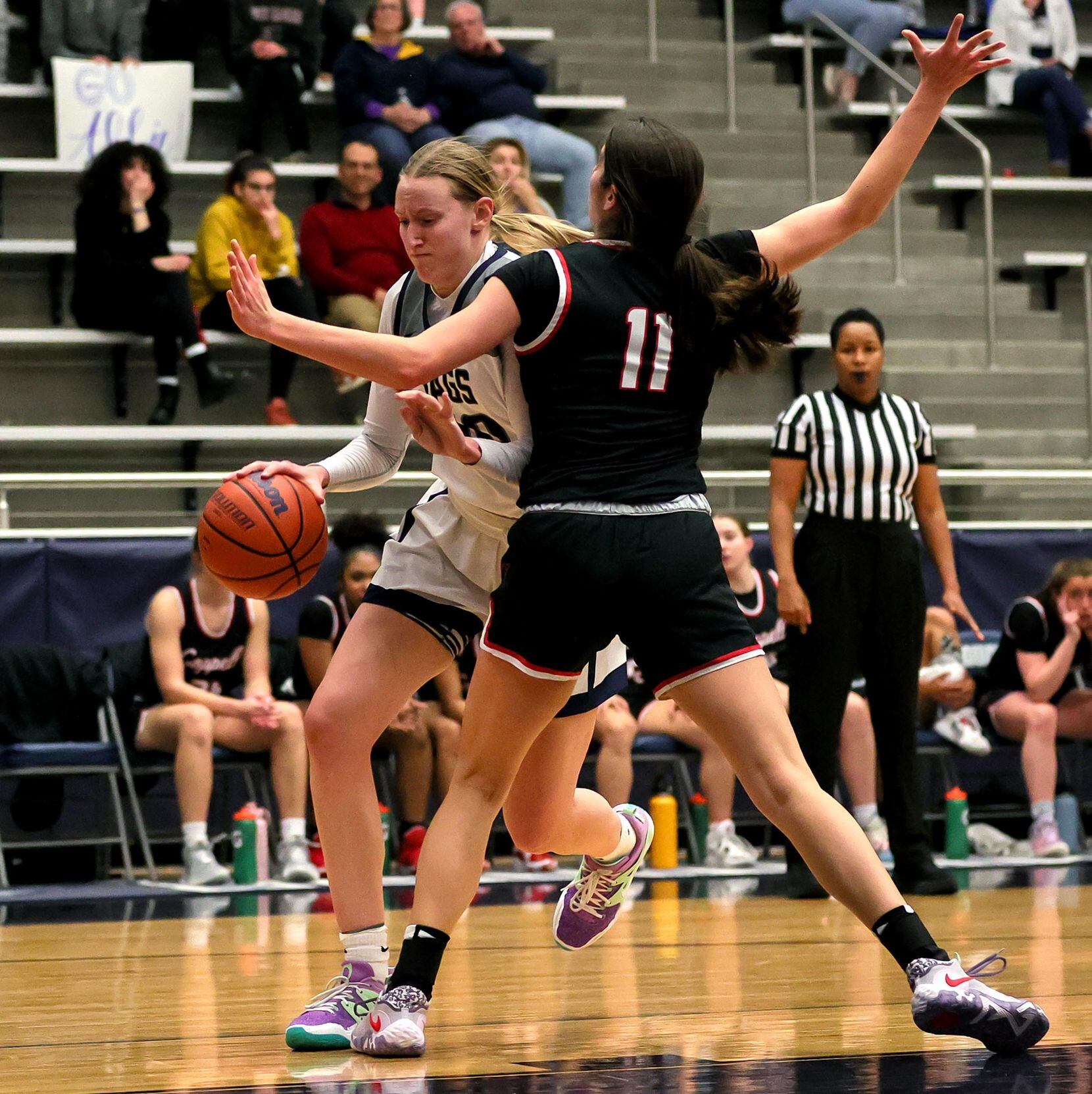 Flower Mound guard Madison Cox, (left) tries to get around Coppell guard Waverly Hassman...