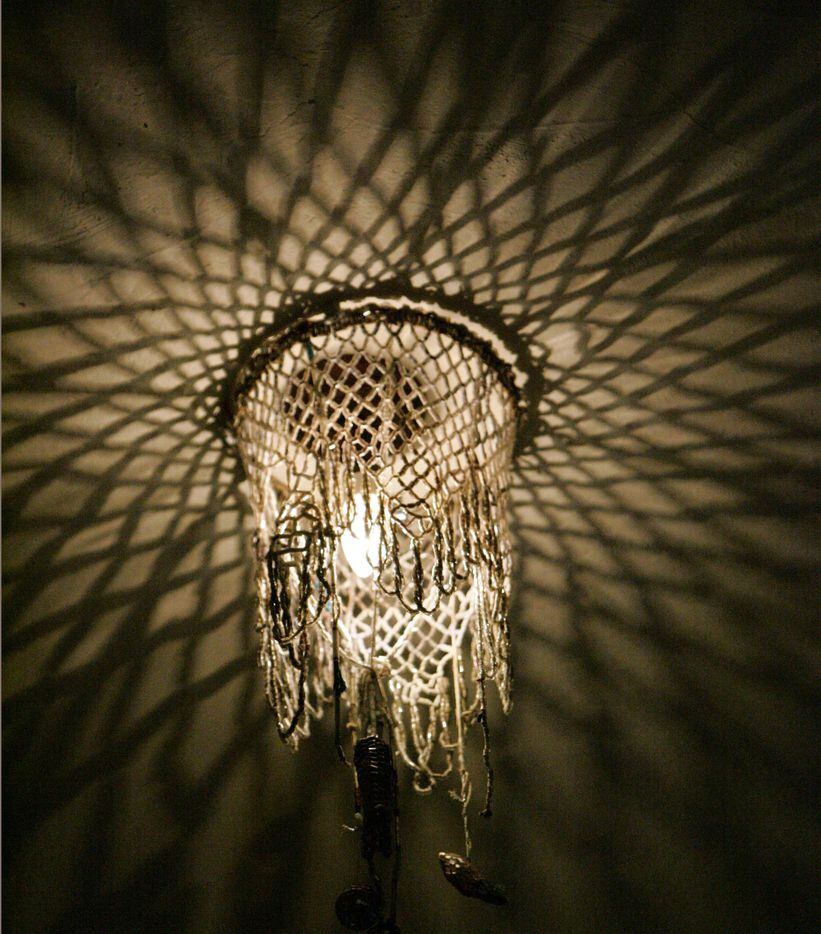 A vintage, beaded light fixture in the front corner of the sanctuary space at actress Ronnie...
